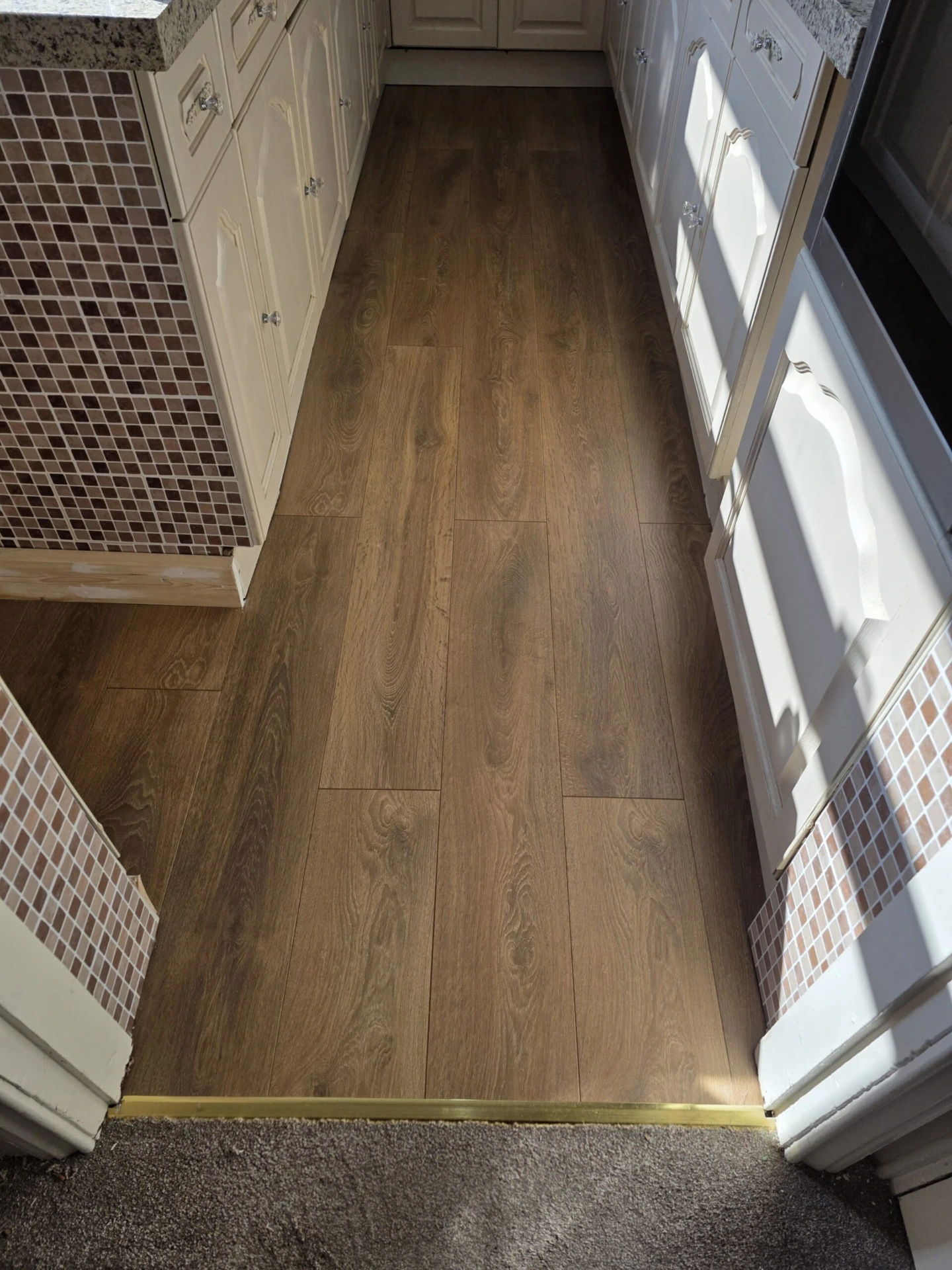 Laminate Flooring Replacement and Skirting Board Installation — completed work photograph