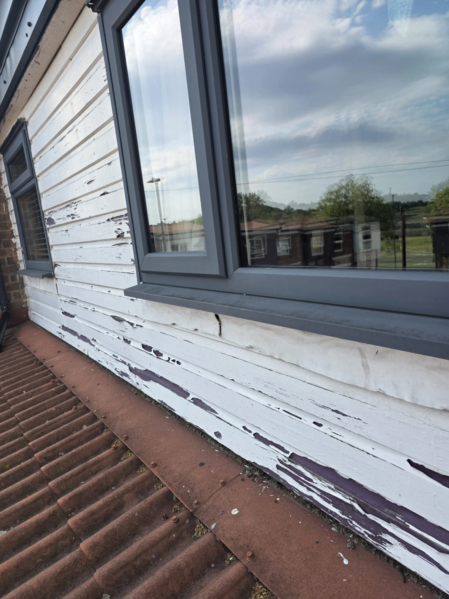 Replacement of Wooden Cladding with Anthracite Grey Composite Panels — before work started photograph