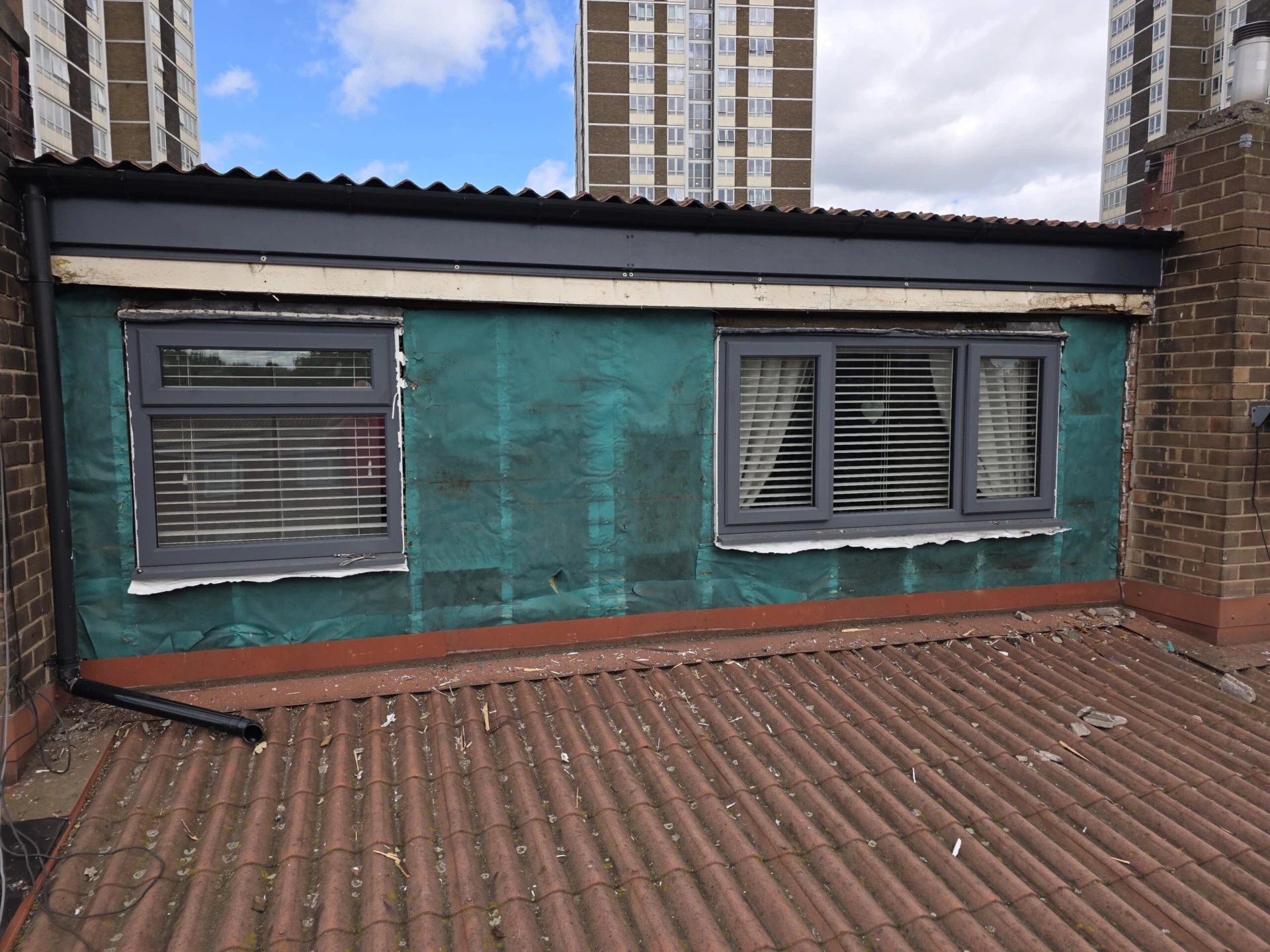 Replacement of Wooden Cladding with Anthracite Grey Composite Panels — work in progress photograph