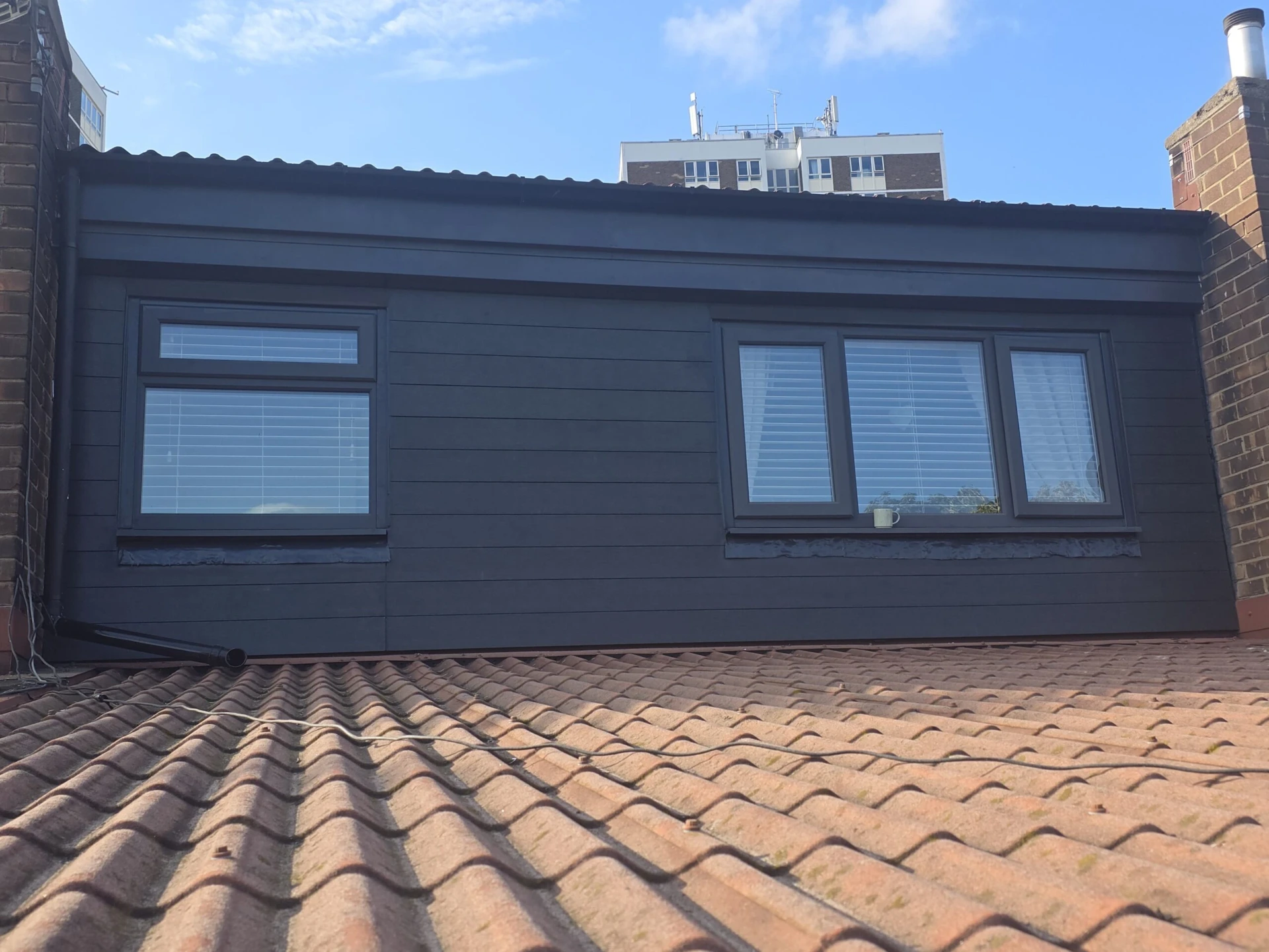 Replacement of Wooden Cladding with Anthracite Grey Composite Panels — completed work photograph